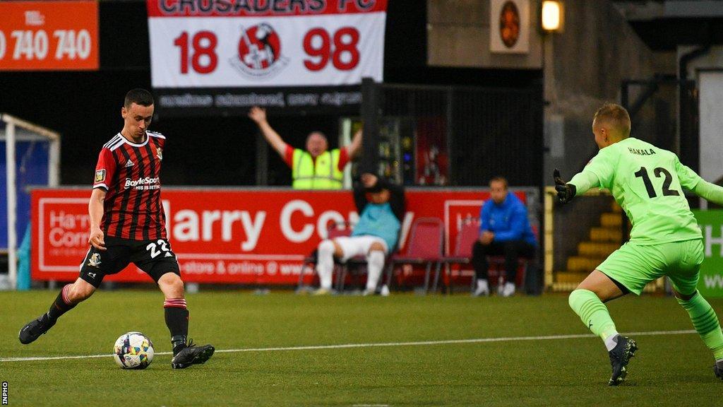 Paul Heatley slots home the only goal as Crusaders defeated FC Haka at Seaview