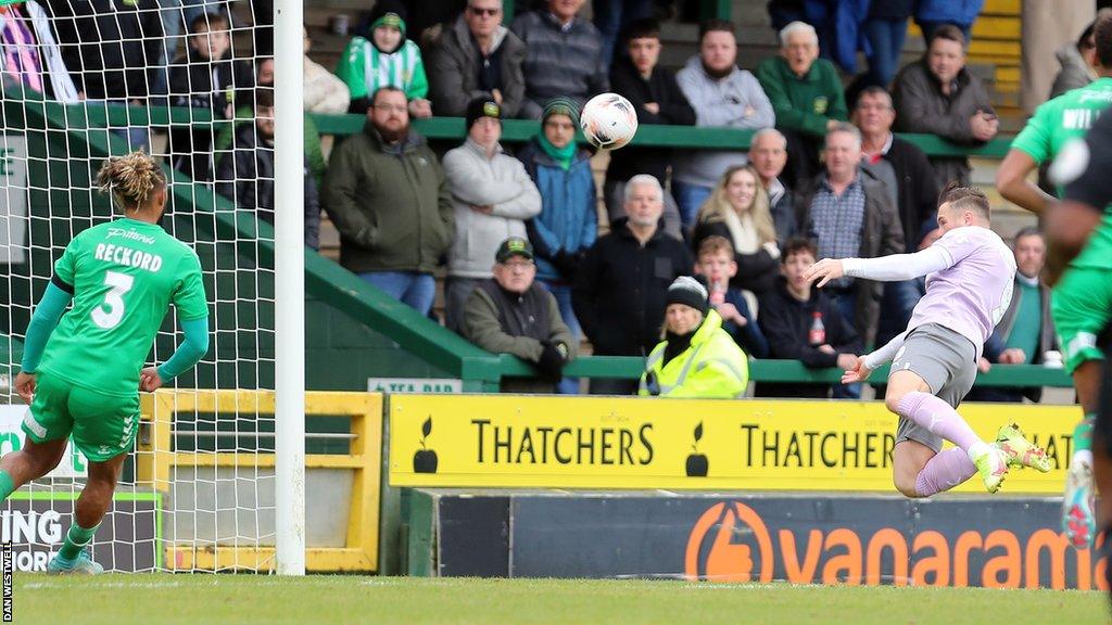 Notts County striker Macaulay Langstaff scores a header against Yeovil