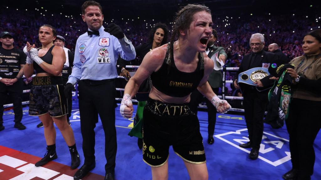 Katie Taylor celebrates after beating Chantelle Cameron