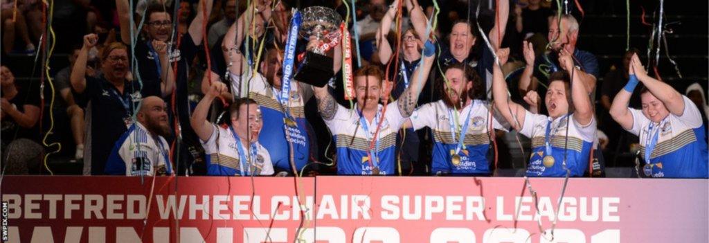 James Simpson holds aloft the Grand Final trophy