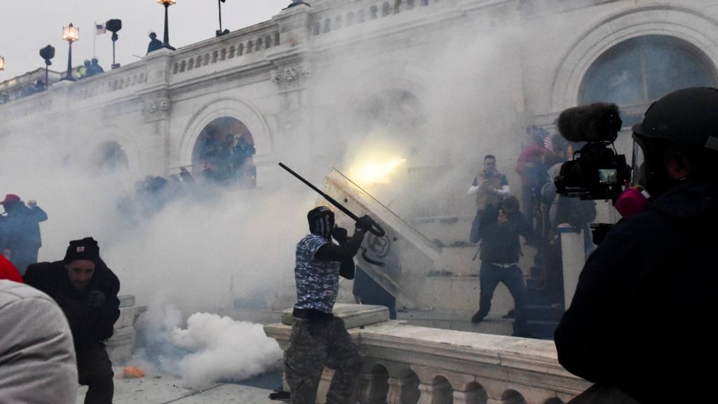 Pro-Trump rally / US Congress counting electoral college votes: Metropolitan Police (MPD) officers use tear gas to clear Pro-Trump supporters (protesters, protestors, demonstrators) who have gathered for a rally, as they attempt to enter the US Capitol, in Washington, DC, USA, 6th January 2021.