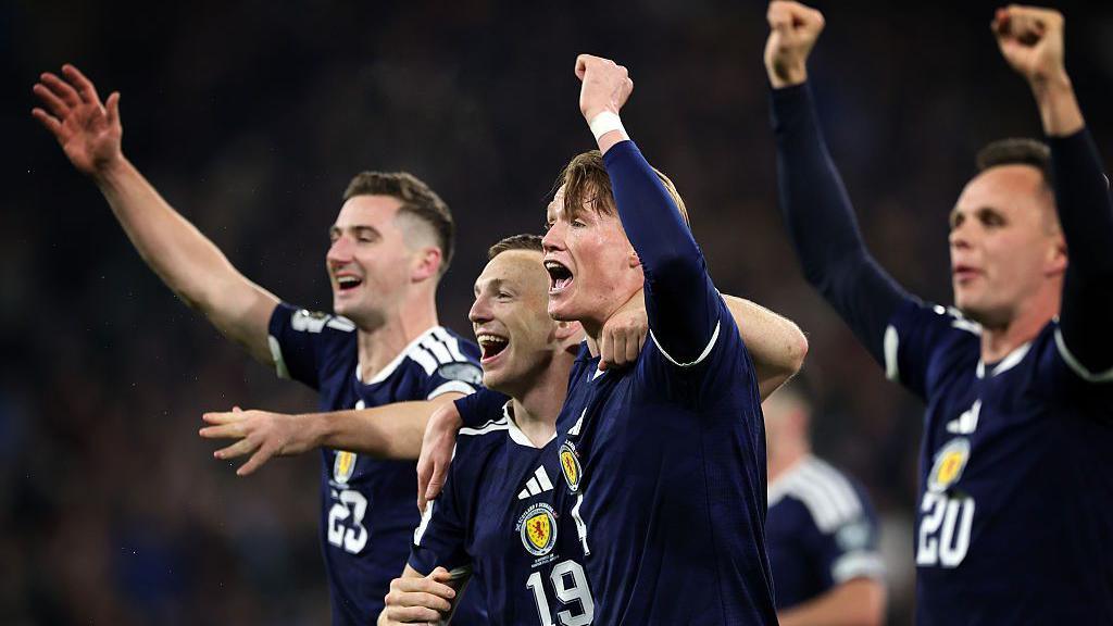 Scott McTominay leads Scotland's celebrations after qualifying for the World Cup