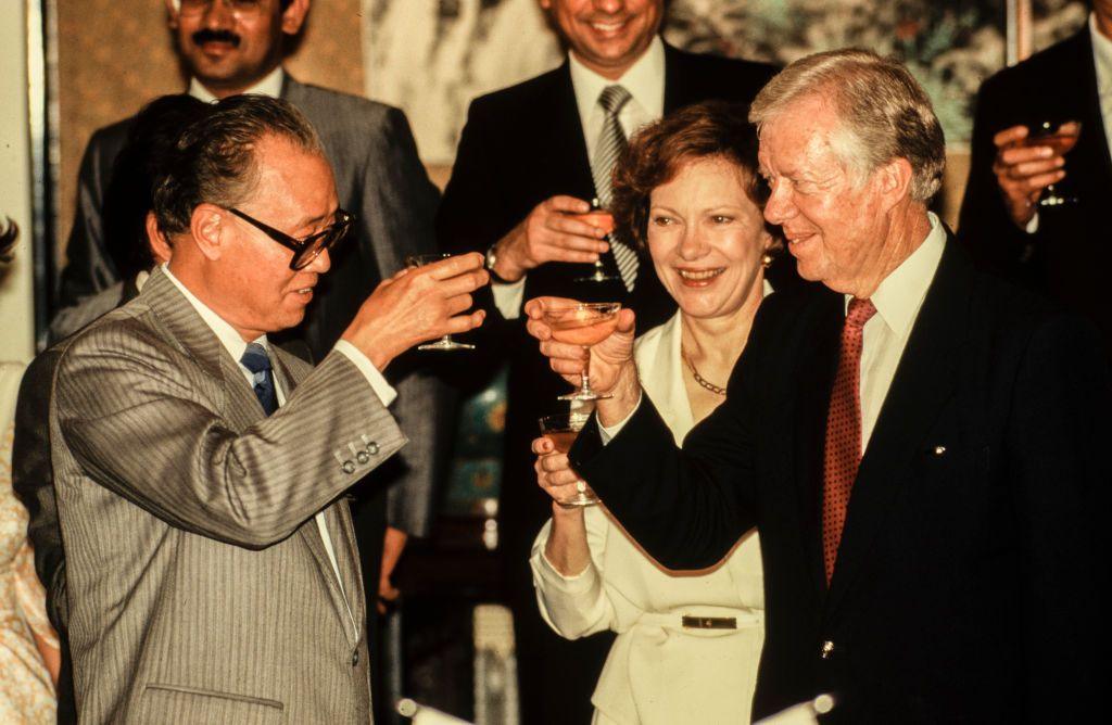 Chinese Premier Zhao Ziyang shares a toast with married couple, former US First Lady Rosalyn Carter and former US President Jimmy Carter, Beijing, China, June 29, 1987. 