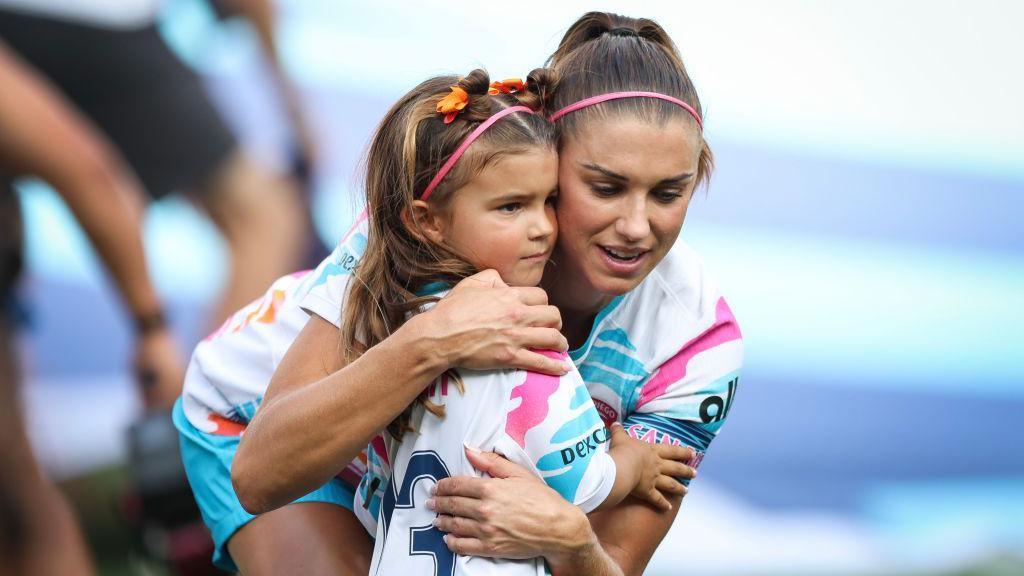 Alex Morgan hugs her daughter, Charlie 