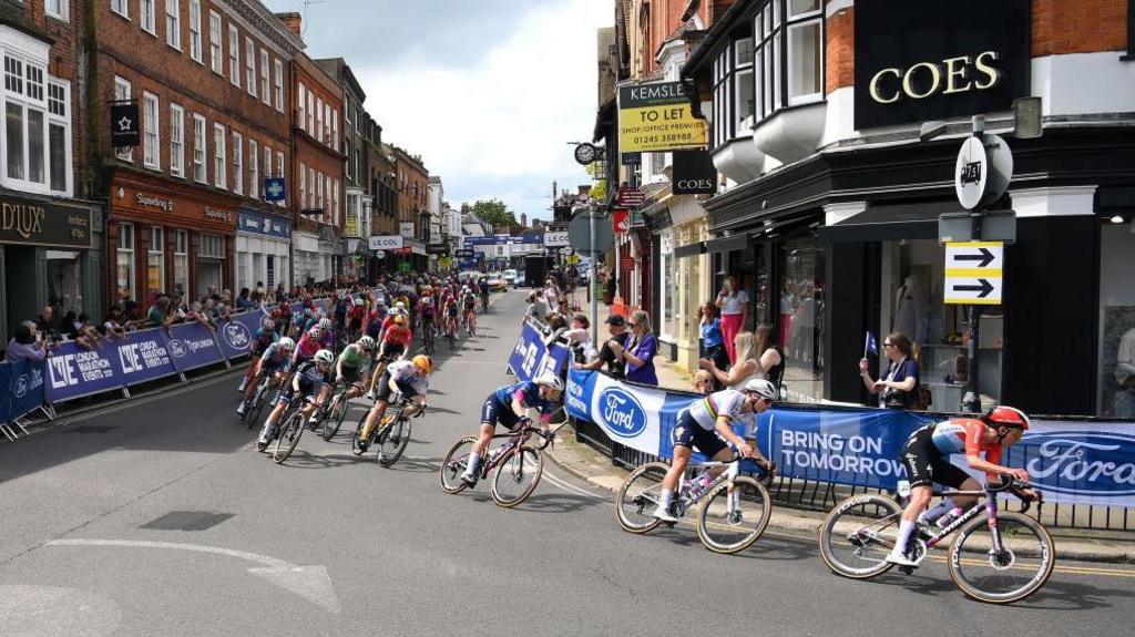 A general view of Anniina Ahtosalo of Finland and Team Uno-X Mobility, Lorena Wiebes of The Netherlands - Blue Leader Jersey, Lotte Kopecky of Belgium, Christine Majerus of Luxembourg and Team SD Worx-Protime and the peloton passing through a Maldon village during the 10th Ford RideLondon Classique 2024, Stage 2 a 142.6km stage from Saffron Maldon to Maldon / #UCIWWT / on May 25, 2024 in Maldon, England. (Photo by Alex Broadway/Getty Images)