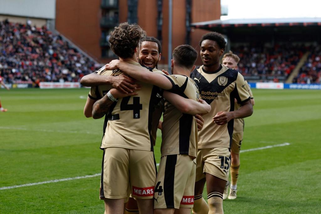 Rotherham United players celebrate
