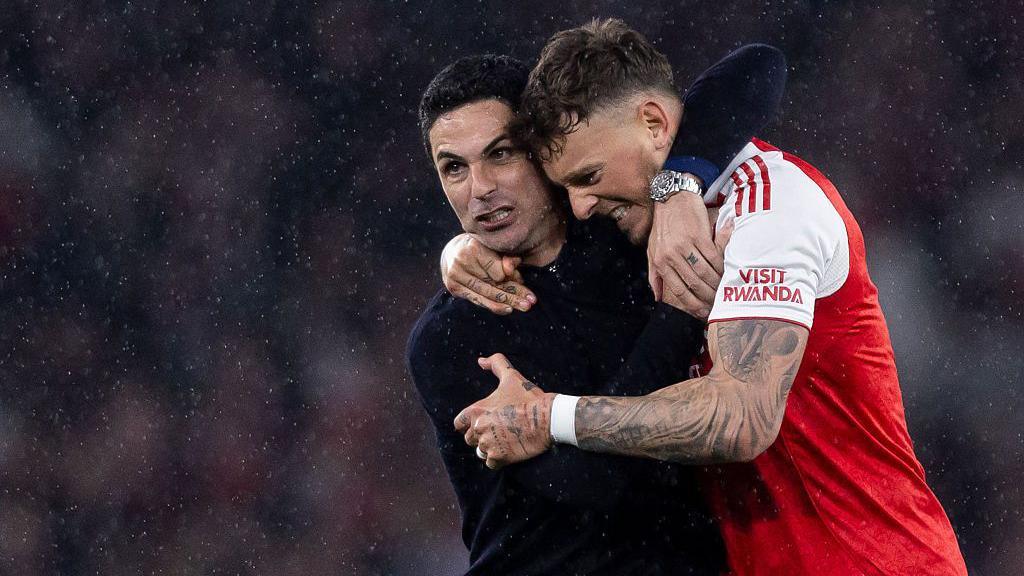 Mikel Arteta manager of Arsenal and Ben White of Arsenal hugging to celebrate their sides victory