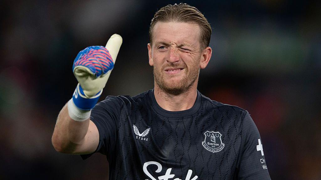 Jordan Pickford winks and gives a thumbs-up