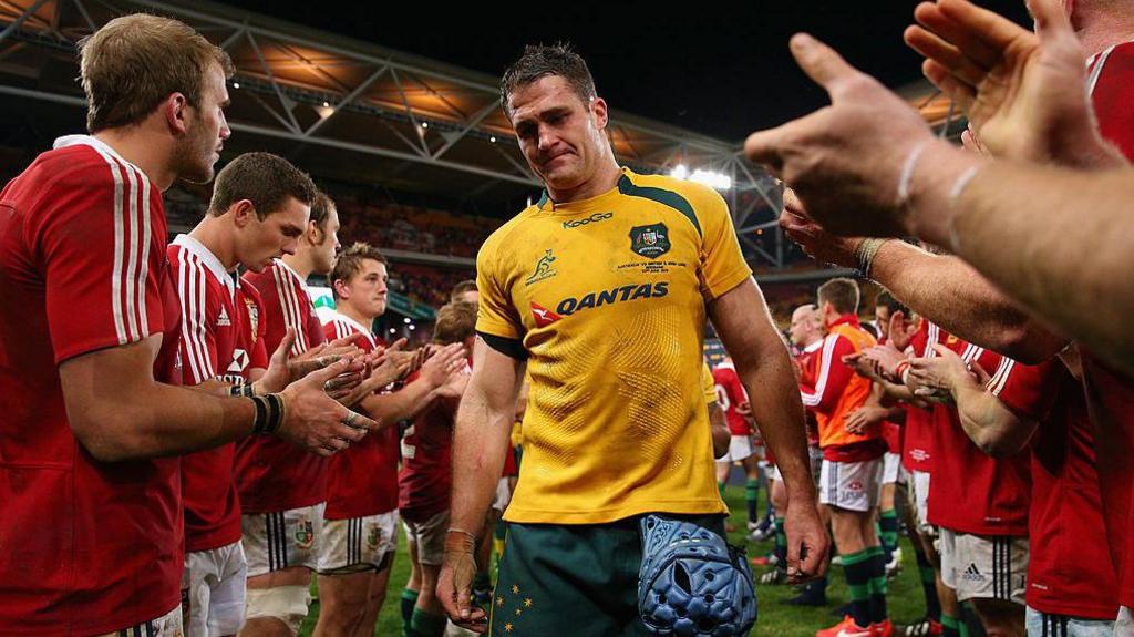 James Horwill is clapped off by the Lions