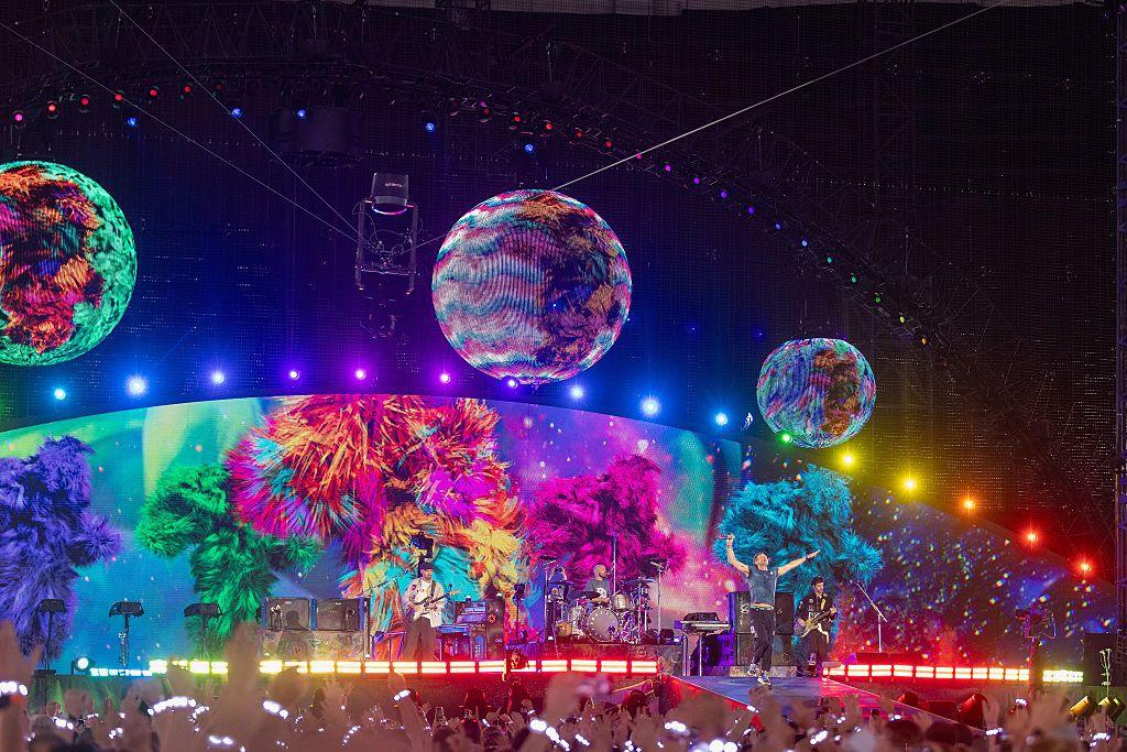 A shot of Coldplay's Wembley concert, showing the stadium awash in colour