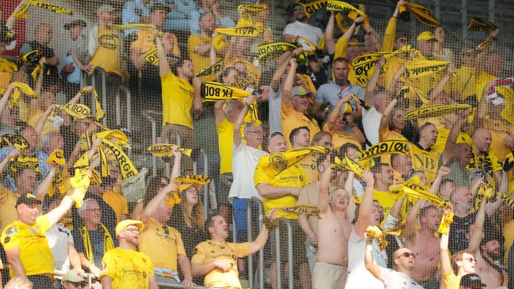 Bodo/Glimt supporters wave scarves