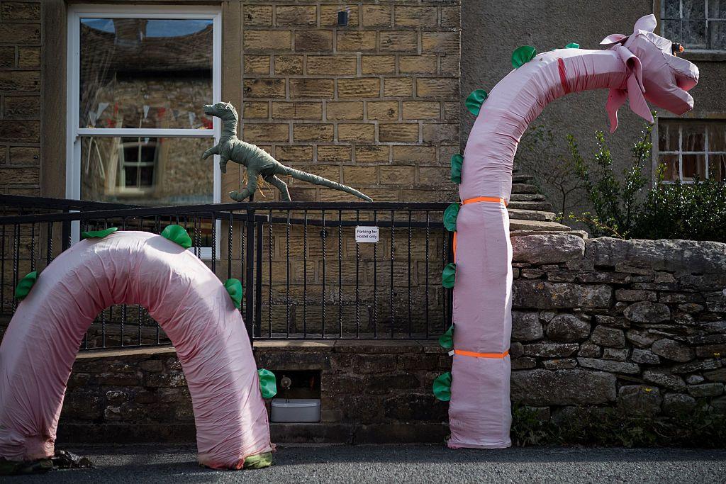 This model shows the Loch Ness monster coming out of the road. The model is covered in pink material and had green scales attached.