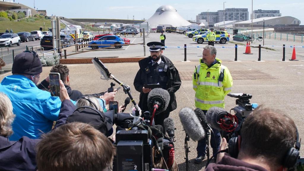 Chief Superintendent Adam Hays gives a statement to the media at the scene on Madeira Drive, Brighton. The bodies of three women were recovered from the sea in Brighton early today, Sussex Police said