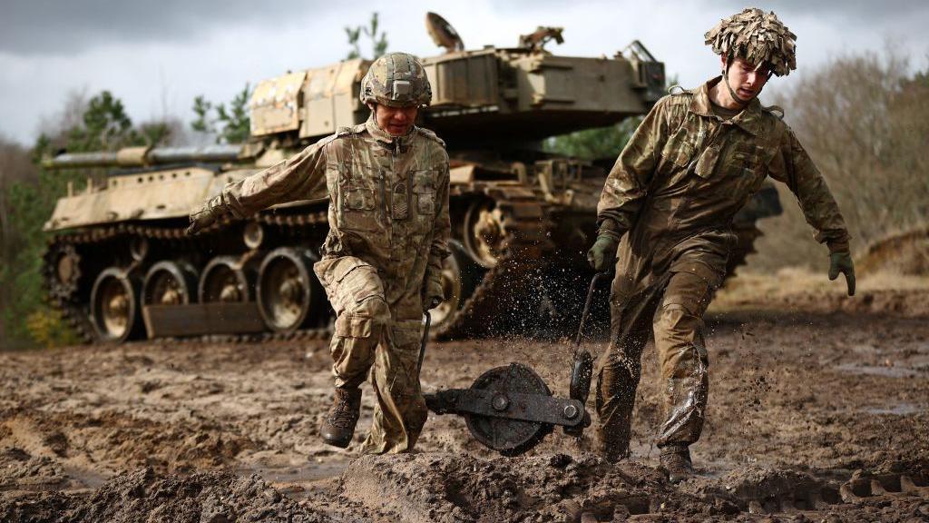 Soldiers with a tank during a training exercise in Longmoor, Hampshire in 2022