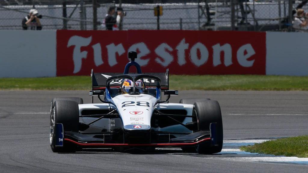 Jamie chadwick driving in an Indy NXT car