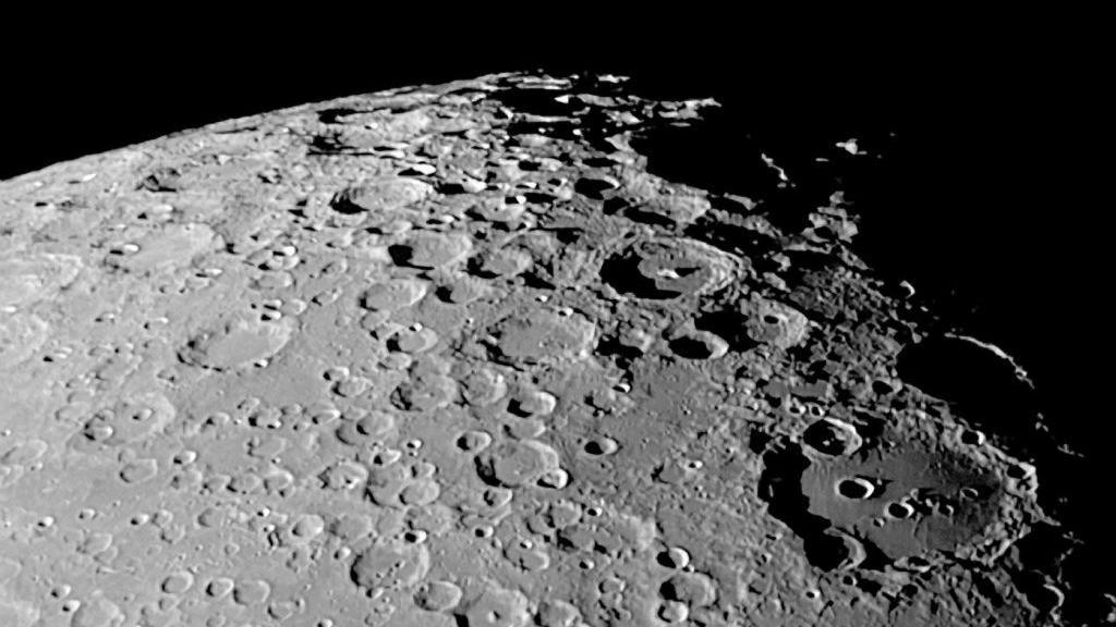 Image shows the craters on the surface of the moon. 