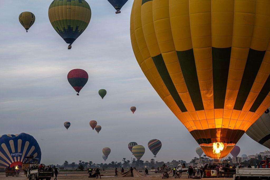 Multiple hot air balloons ascend into the sky in Egypt's southern city of Luxor - Thursday 9 January 2025.