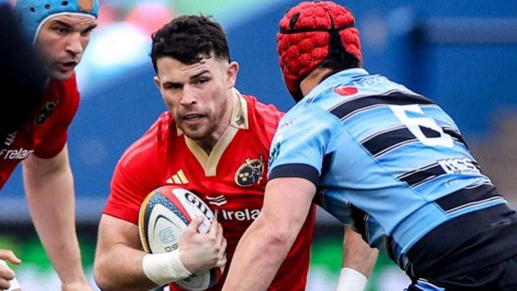 Calvin Nash of Munster is tackled by James Botham of Cardiff 