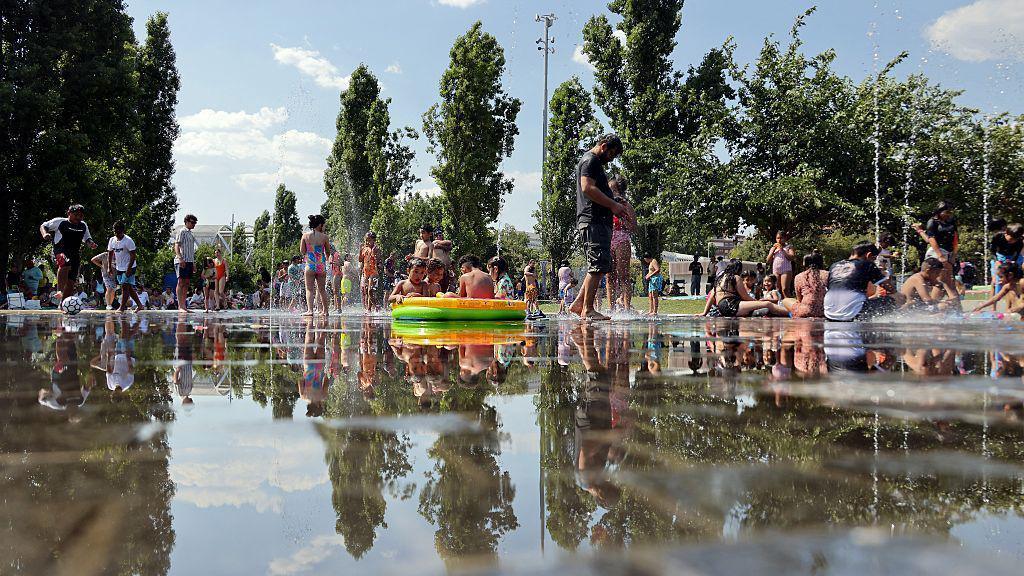 People cool off in water in Madrid