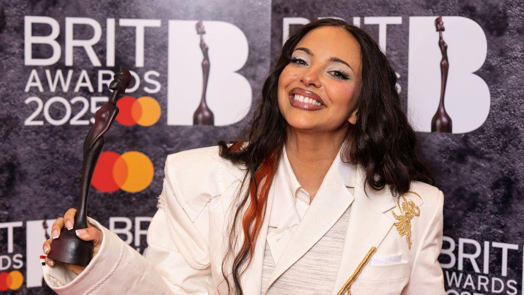 Jade Thirlwall holding Brit Award.