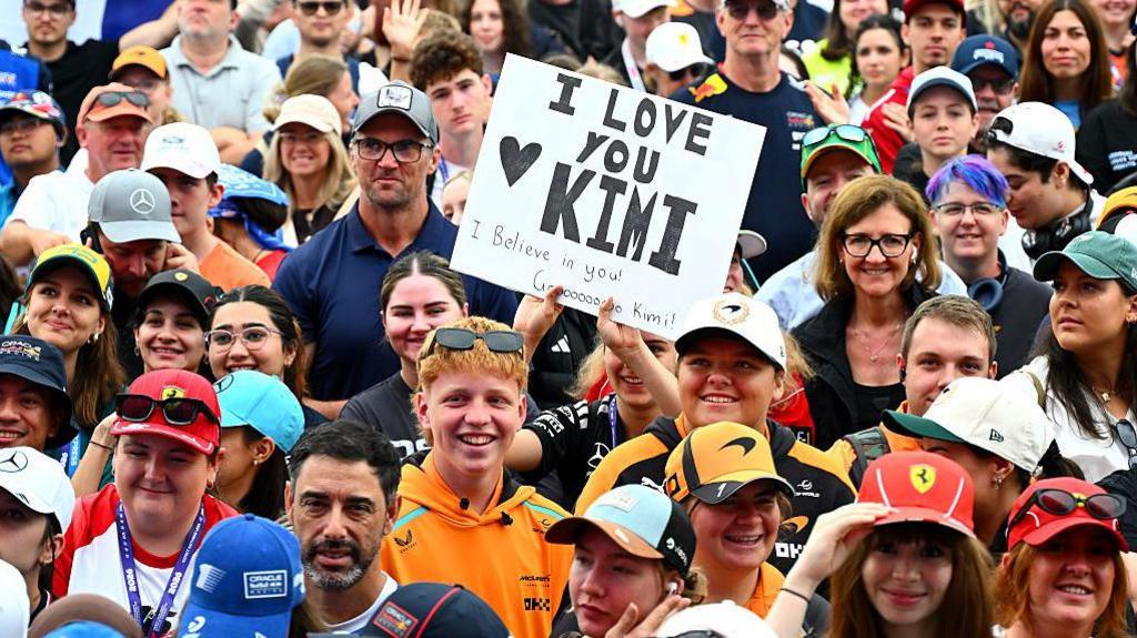 Fans hold up signs for Mercedes driver Kimi Antonelli in Melbourne 