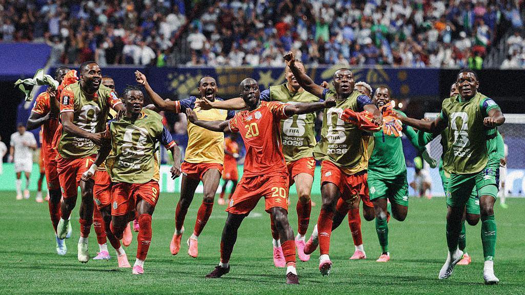 Congo team celebrating on the pitch.