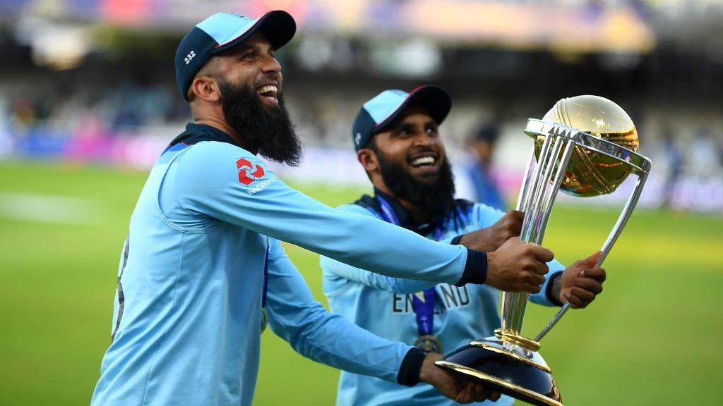 Adil Rashid and Moeen Ali celebrate England's World Cup win