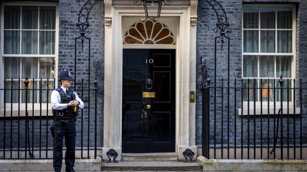 Police officer stands outside 10 Downing Street