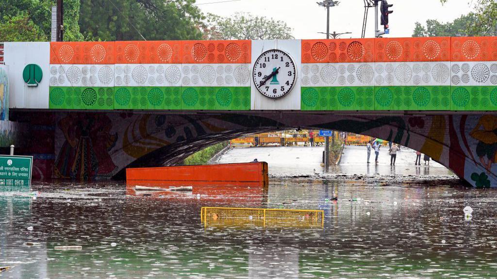 A Truck is stuck in logged water under the Minto Bridge near Connaught Place after a heavy rain on June 28, 2024 in New Delhi, India.