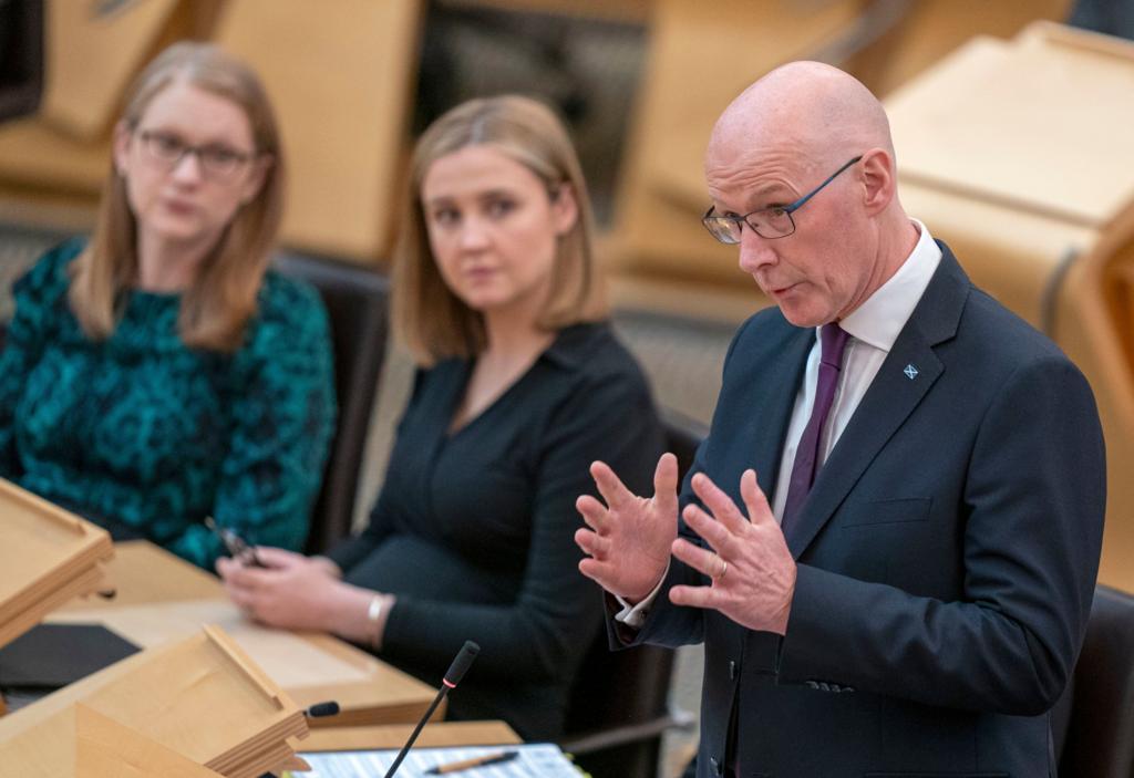 John Swinney is questioned by opposition party leaders during FMQs