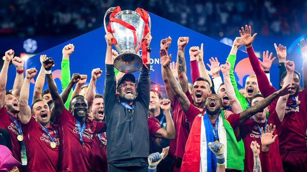 Liverpool lifting the Champions League trophy in 2019