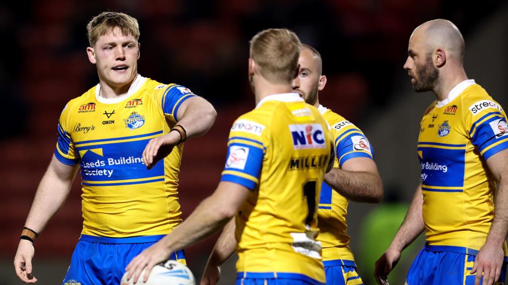 McDonnell scores four tries as Rhinos rout Salford