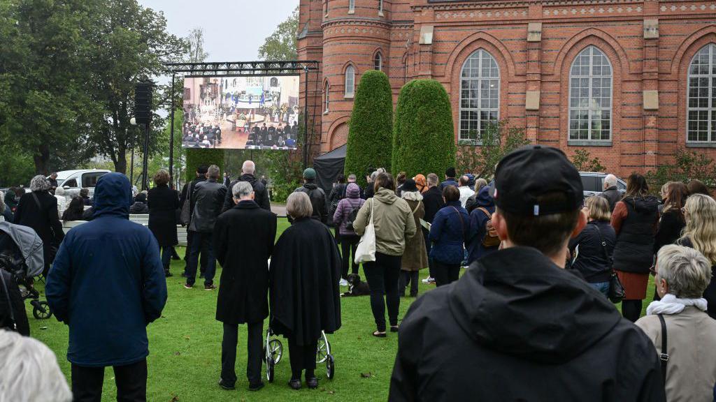 Mourners gathered outside Fryksande church