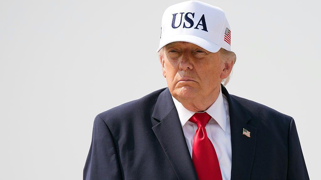 President Donald Trump walks to board Air Force One as he departs Bismarck Municipal Airport on July 01, 2026 in Bismarck, North Dakota.
