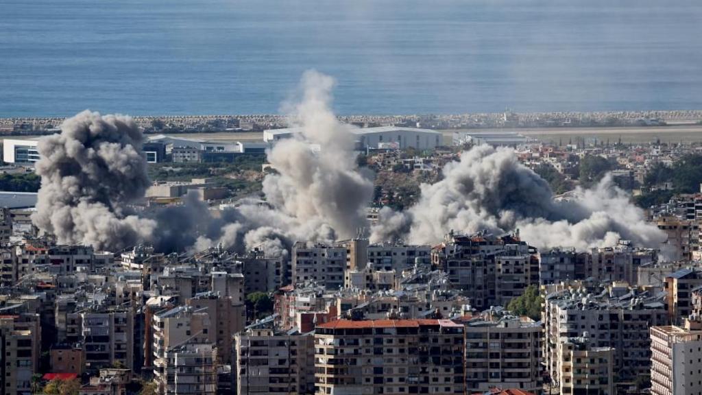 Smoke billows over the southern suburbs of Beirut after a reported Israeli air strike.