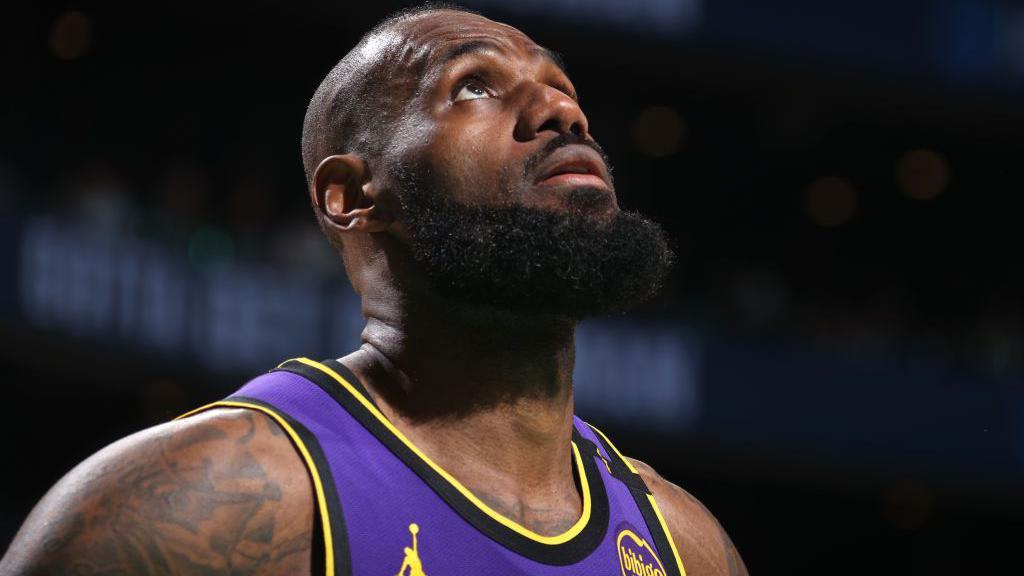 LeBron James looks to the heavens after going off injured during the LA Lakers defeat to Boston Celtics 