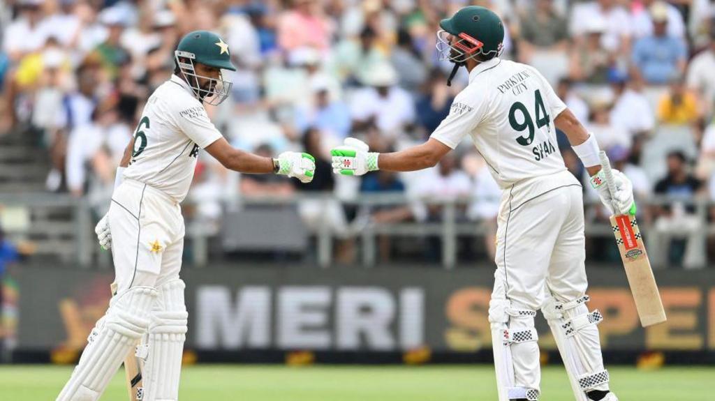 Babar Azam and Shan Masood bump fists