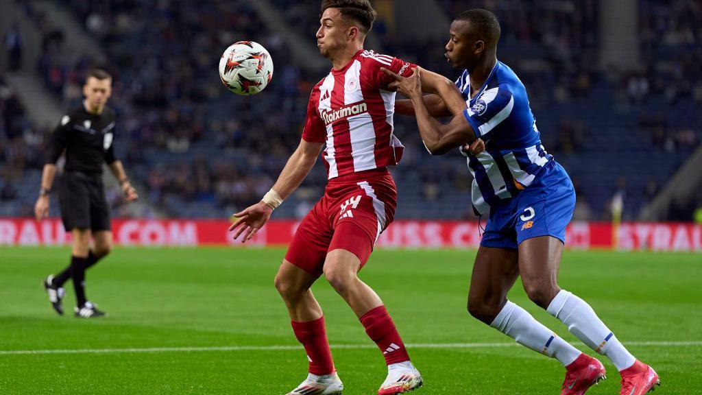 Charalampos Kostoulas (left) holds off Porto's Tiago Djalo during last season's Europa League