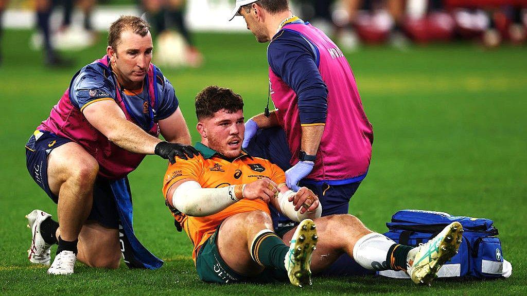 Carlo Tizzano being tended to by medics