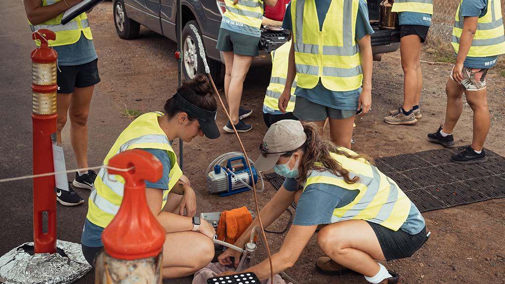 Students testing the plastic road samples