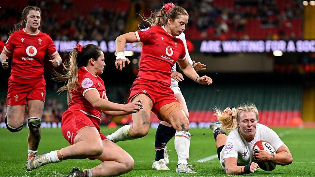 Abi Burton dives in to score agaisnt Wales