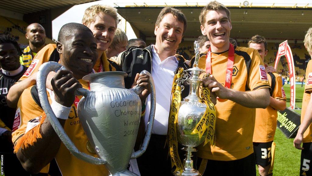 George Elokobi with his Wolves team-mates and the Championship trophy