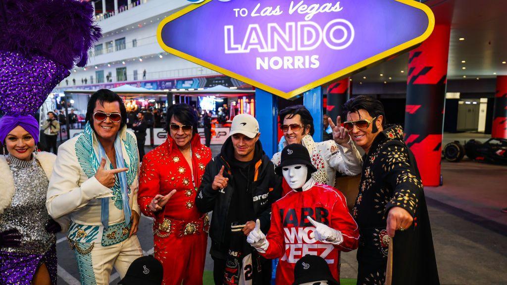 McLaren's Lando Norris poses for a photograph with four Elvis Presley impersonators before Las Vegas Grand Prix first practice