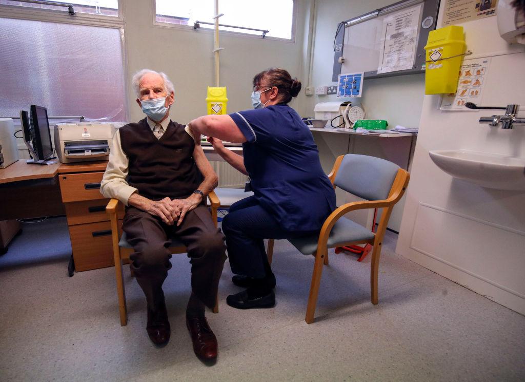 Brian Horne gets the vaccine from a nurse in a GP's surgery in Chalfont St Peter