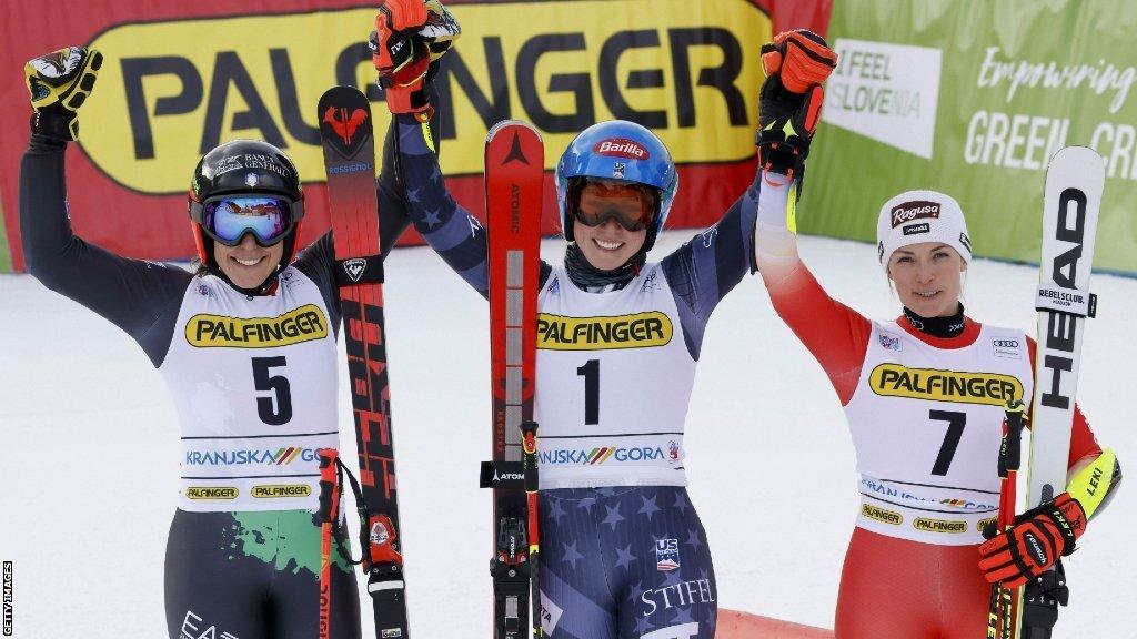 Mikaella Shiffrin, centre, with second-placed Lara Gut-Behrami, left, and Petra Vlohva