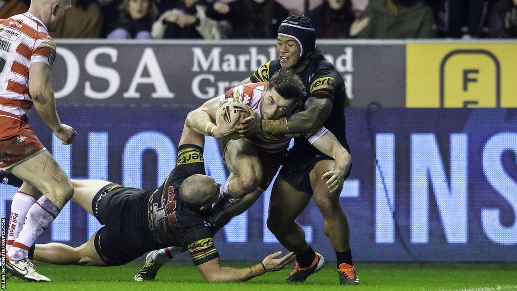 Rugby League - Betfred World Club Challenge - Wigan Warriors v Penrith Panthers - DW Stadium, Wigan, England - Wigan's Jake Wardle on his way to a try against Penrith.