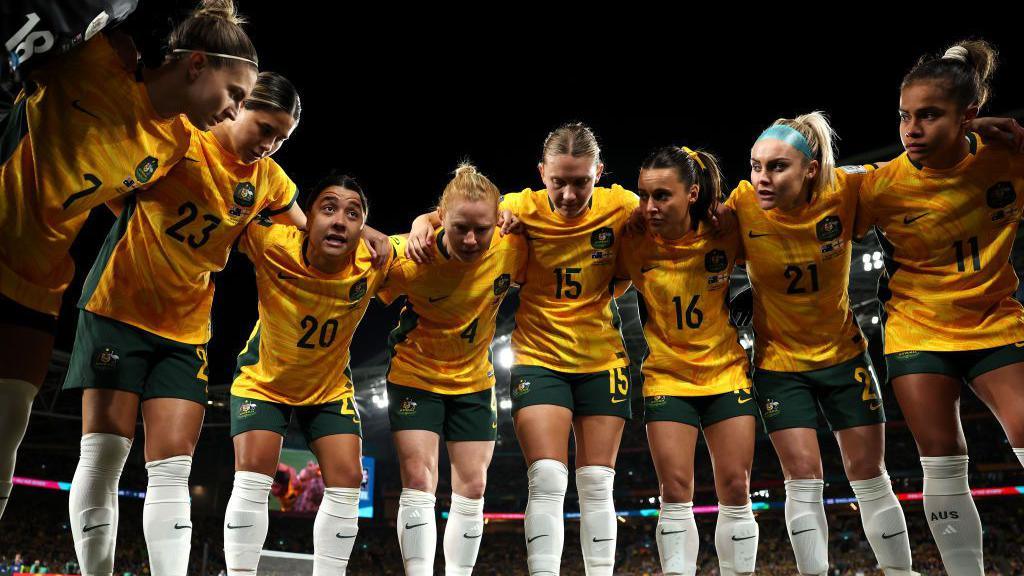 Sam Kerr speaks to her team in a huddle before a World Cup match in Sydney in 2023