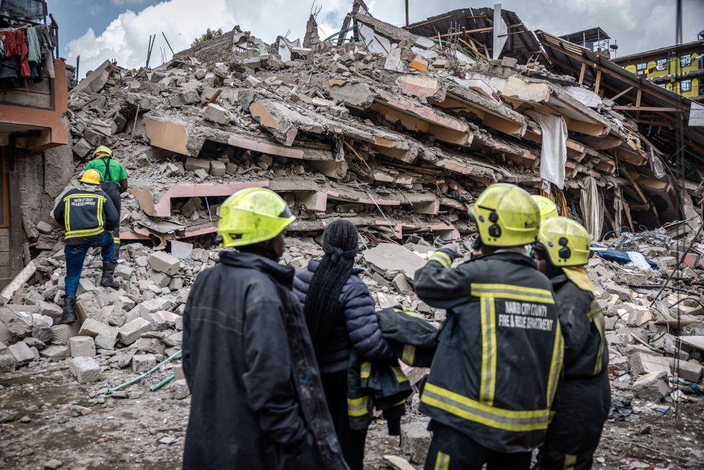 Nairobi County emergency responders inspect the rubble of a collapsed residential building at Kahawa West residential area in Nairobi on October 20, 2024. Response teams were responding to a building collapse in Nairobi, where people are feared trapped despite a vacation notice. (Photo by LUIS TATO / AFP)