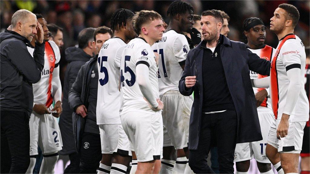 Luton manager Rob Edwards gathers his players