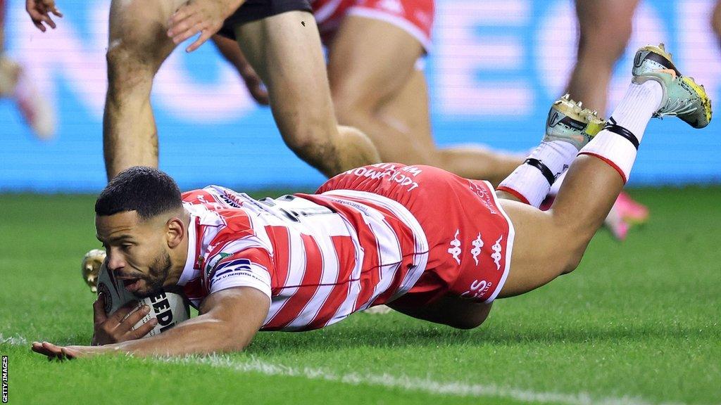 Kruise Leeming of Wigan Warriors goes over for a try during the World Club Challenge match between Wigan Warriors v Penrith Panthers at DW Stadium on February 24, 2024 in Wigan, England. (Photo by Jan Kruger/Getty Images)